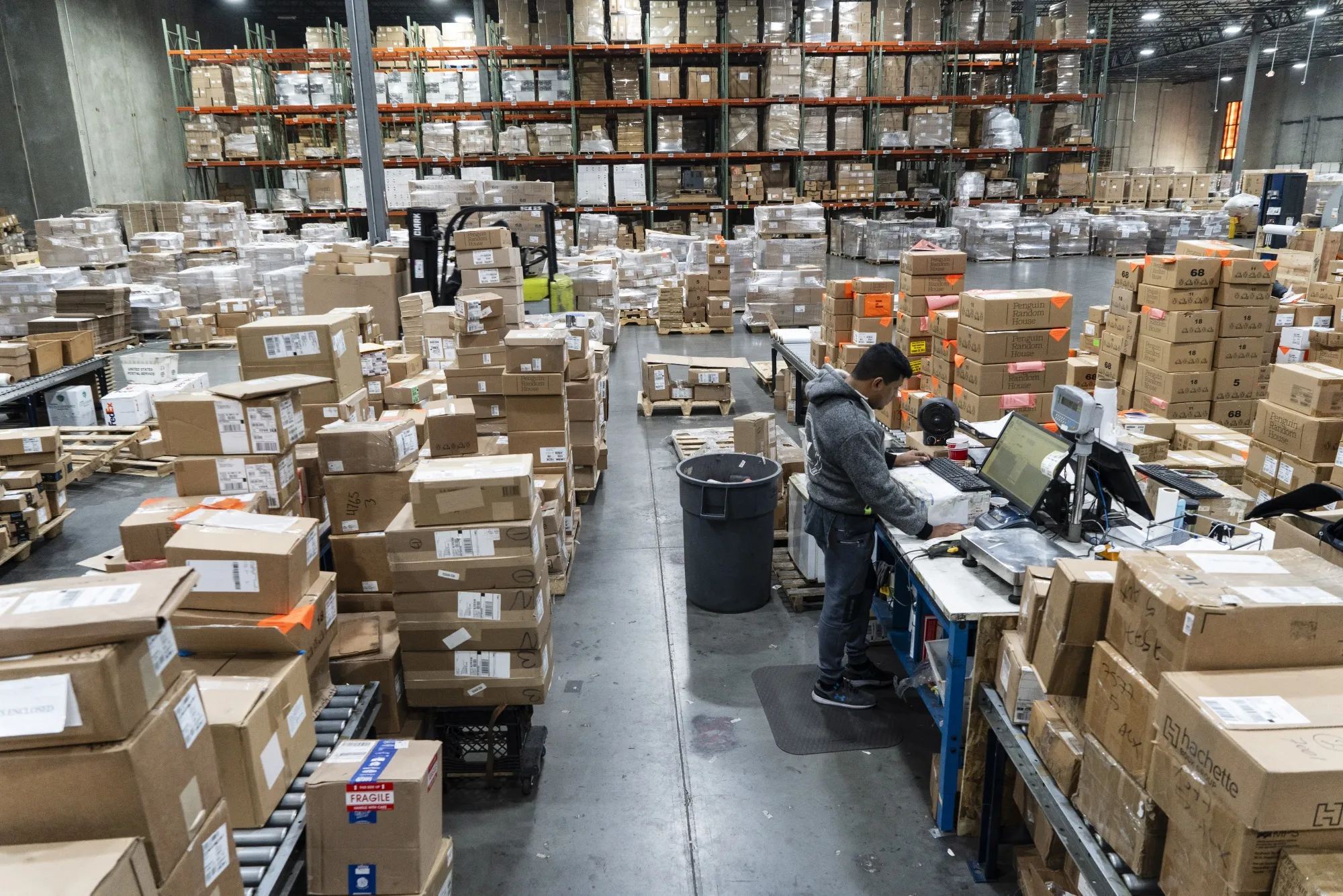 A worker sorts packages at a fulfillment center in Elizabeth, New Jersey.