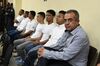 Sergio Rodriguez (right), along with six others who were accused of murdering indigenous environmental activist Berta Cáceres, sits in a Tegucigalpa, Honduras, courtroom on Sept. 17, 2018.