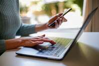 Woman Working From Home With A Laptop