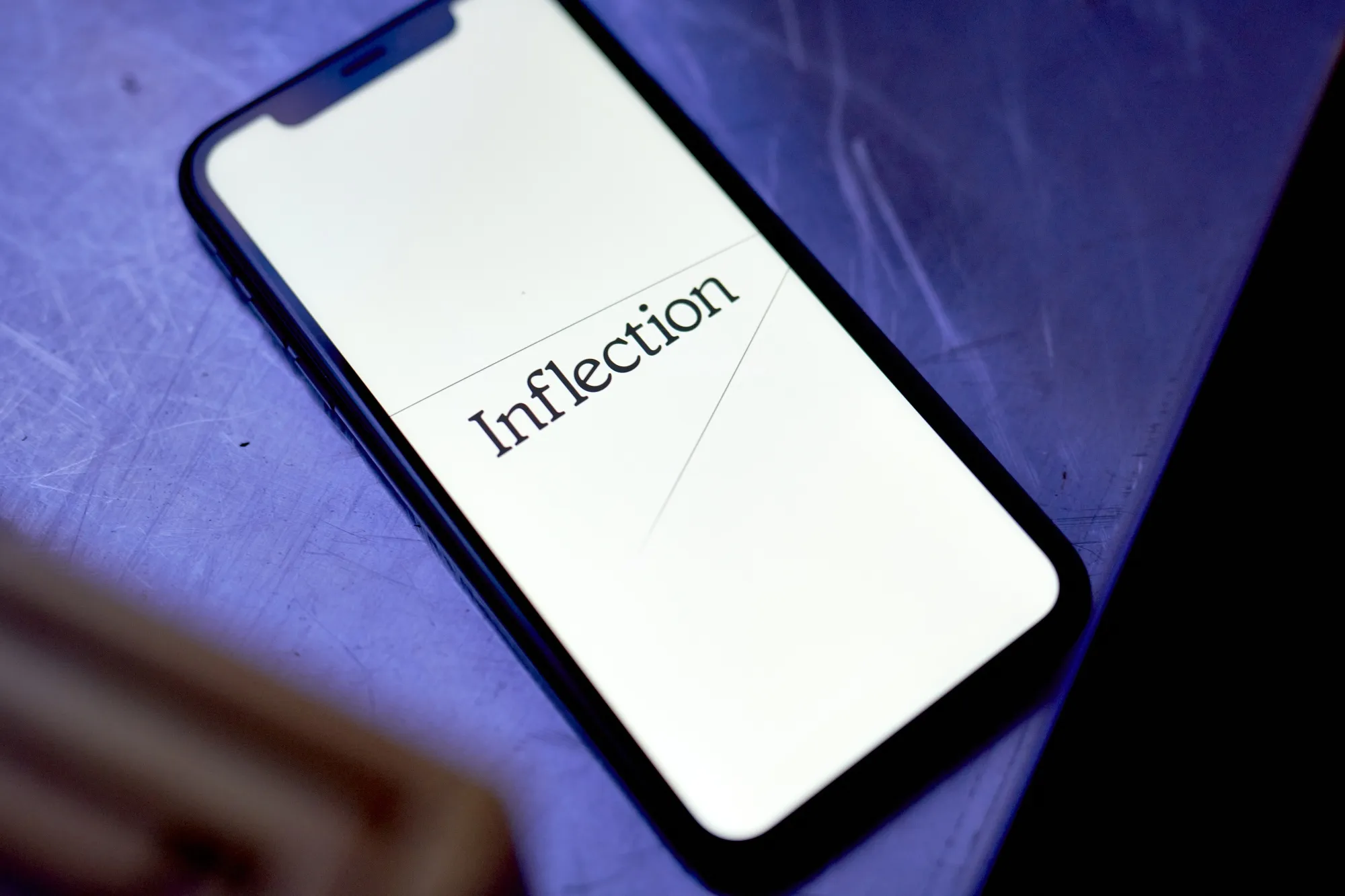 The Inflection logo on a smartphone arranged in New York, US, on Thursday, Aug. 17, 2023.&nbsp;