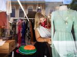 A worker dresses a mannequin at a store in Mobile, Alabama.