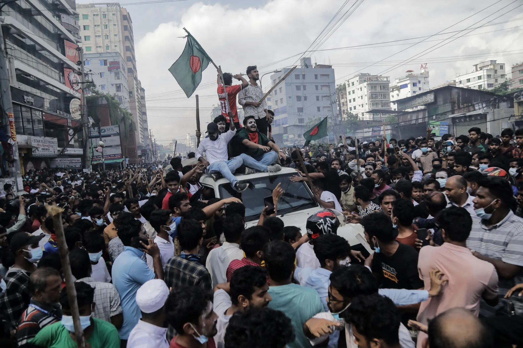 People celebrate the fall of Bangladesh Prime Minister Sheikh Hasina in Dhaka on Aug. 5.