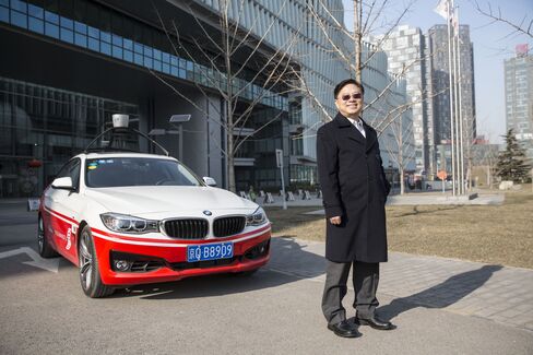 Wang Jing poses next to Baidu’s autonomous car at the company headquarters in Beijing.