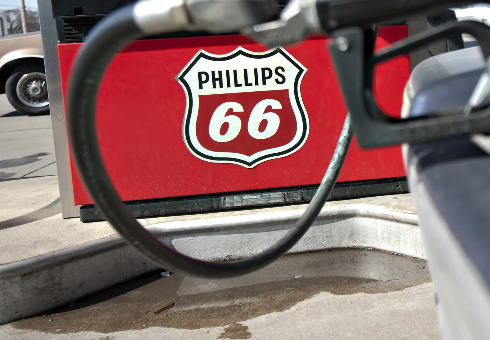 A Phillips 66 logo is seen on a gas pump as a car is filled a Beck's station in Princeton, Illinois, U.S., on Monday, March 5, 2012. Prices have increased 15 percent this year and are 7.8 percent higher than a year earlier.
