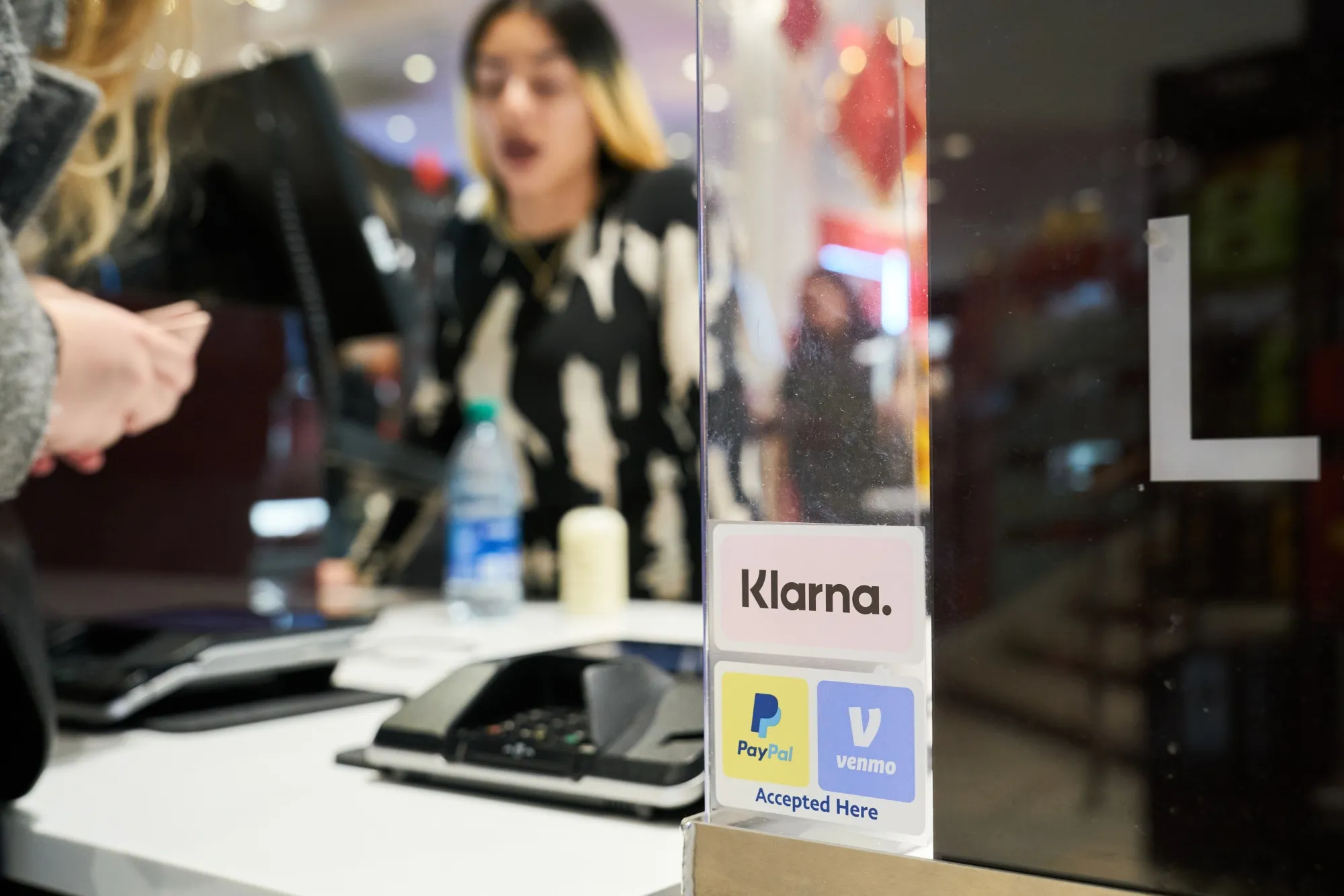 Klarna, PayPal, and Venmo stickers at checkout at the Macy's flagship store in New York.