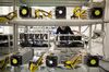 An employee checks power supply units and cooling fans linked to cryptocurrency mining machines at the SberBit mining 'hotel' in Moscow, Russia.