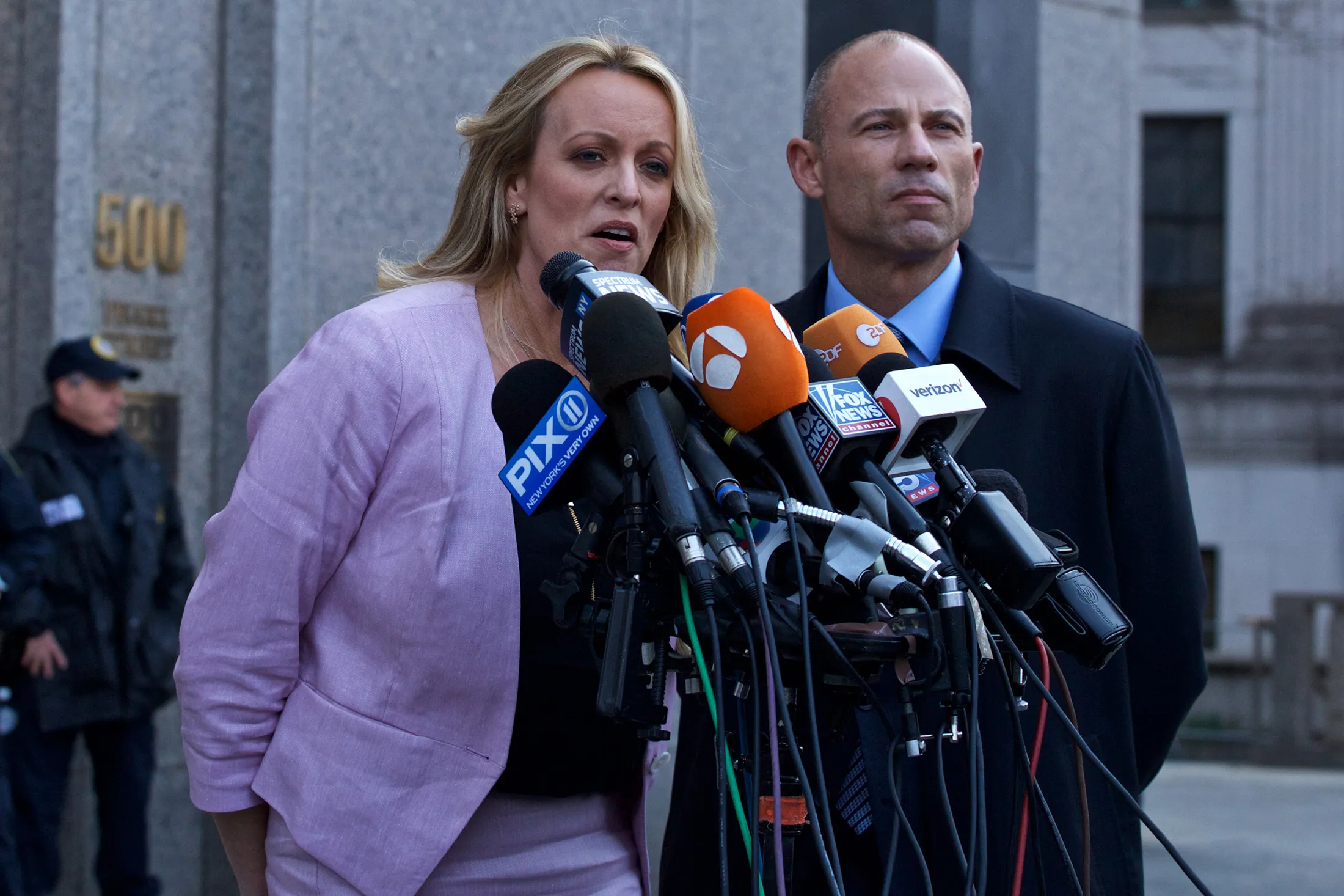 Stormy Daniels, left, speaks to members of the media while attorney Michael Avenatti listens outside Federal Court in New York&nbsp;on&nbsp;April 16.