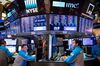 Trading On The Floor Of The NYSE While Stocks Fluctuate As Utilities Offset Retail Slump