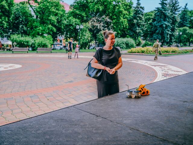 Olha Holynska visits the stage where her 6-year-old daughter was mortally wounded during the missile attack on Chernihiv.