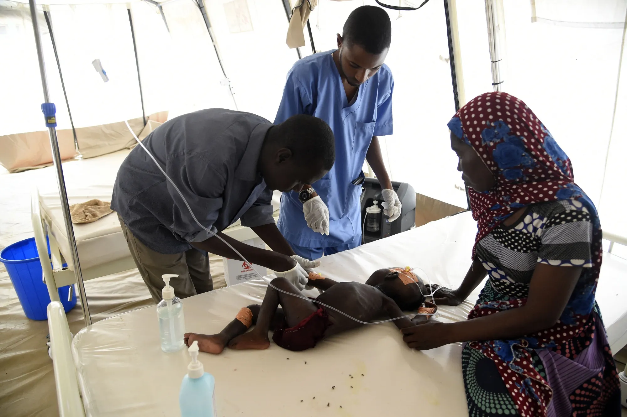 Health officials attend to a child suffering malnutrition in a clinic in Katsina State, northwest Nigeria, in 2022.&nbsp;
