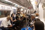 Commuters ride a subway in New York on Jun 30.