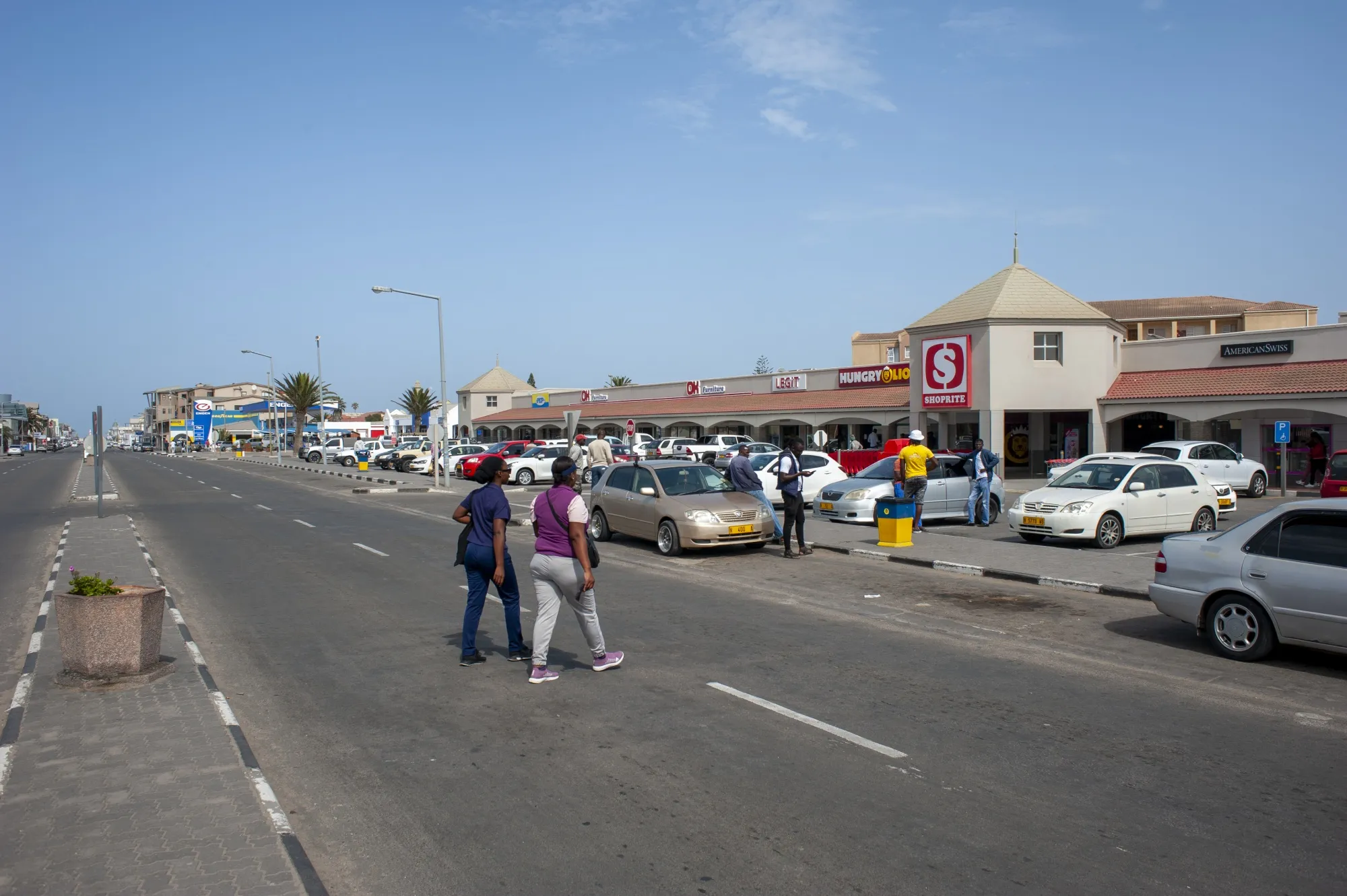 Shoppers head&nbsp;toward&nbsp;a shopping mall in&nbsp;Swakopmund, Namibia.