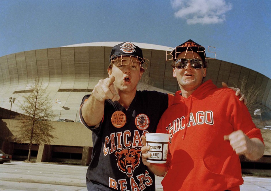 Two fans decked out in Chicago Bears regalia prepare to cheer their team in Super Bowl XX in New Orleans in January 1986. 