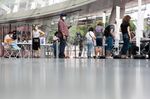 Voters wait in line to vote at the Brooklyn Museum polling site during the New York City mayoral primary election in the Brooklyn borough of New York, U.S., on Tuesday, June 22, 2021.
