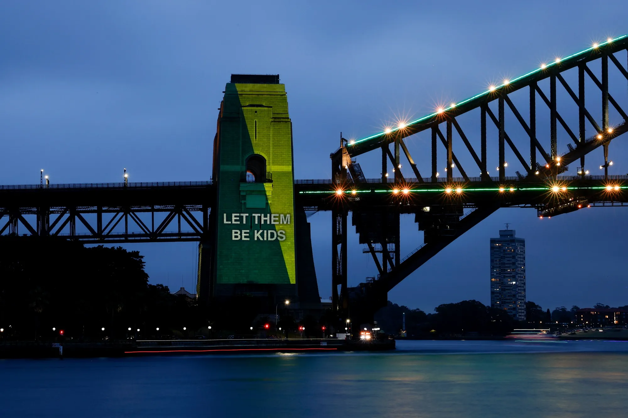 The Sydney Harbour Bridge is illuminated on the first day of Australia’s under-16 social media ban coming into effect.