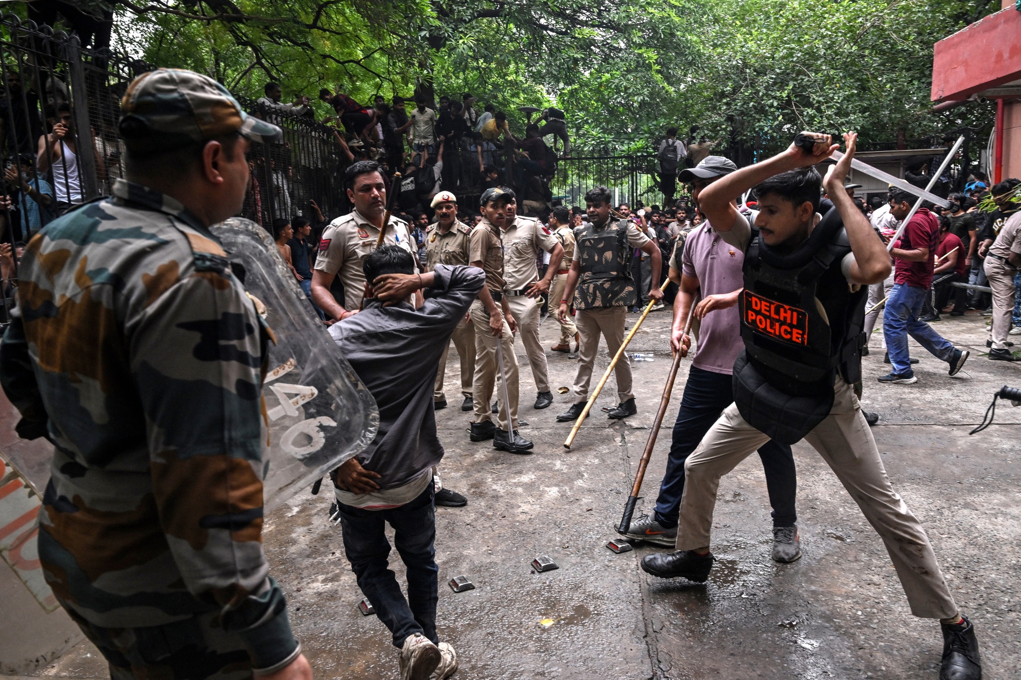 Police personnel clash with activists and supporters of the CJP during a protest in New Delhi on July 20. Photographer: Arun Sankar/AFP/Getty Images
