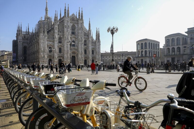 Bikes for rent parked near Duomo Cathedral in Milan. The province is looking to complete a network of protected cycling lanes by 2035.