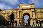 A cyclist passes through Piazza della Republica in Florence, Italy, on Friday, Sept. 22, 2017. U.K. Prime Minister Theresa May will use a speech on Friday in Florence to propose a period of transition after Brexit takes effect in March 2019, aiming to give certainty and clarity to companies worried about the looming split.