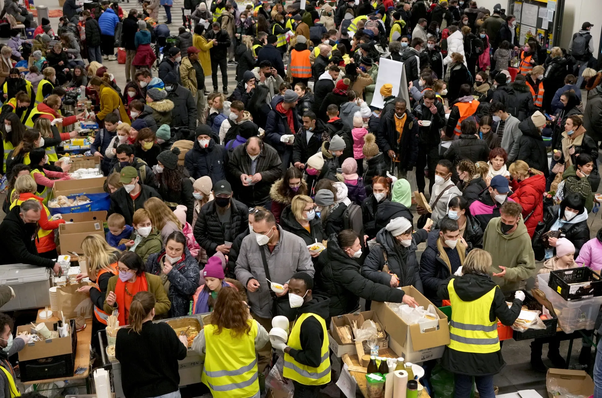 Ukrainian refugees queue for food after their arrival&nbsp;in Berlin on March 8.