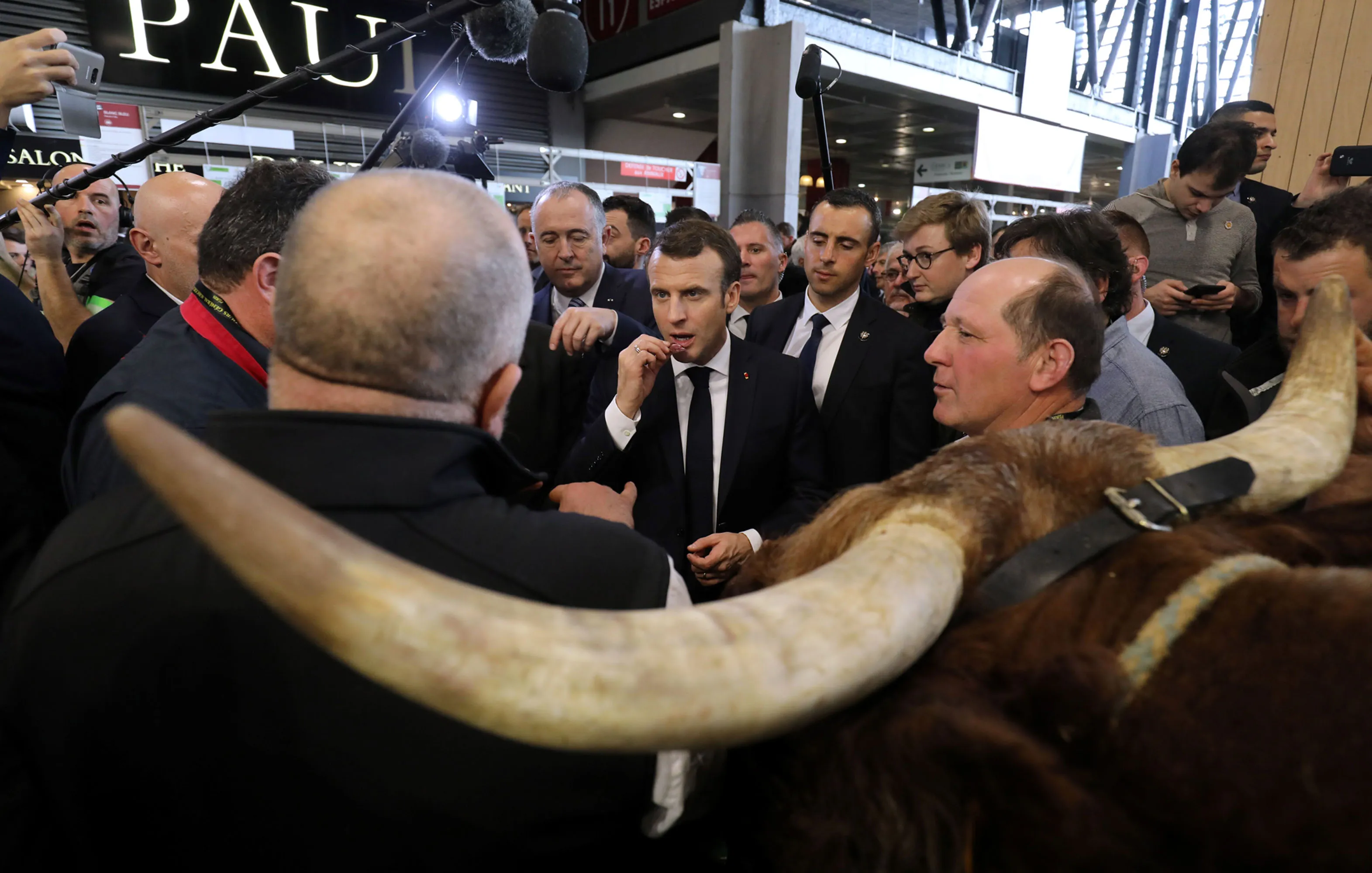 Emmanuel Macron with exhibitors at the 56th International Agriculture Fair in Paris on Feb&nbsp;23.