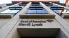 A sign sits above an entrance into the Bank of America Merrill Lynch Financial Centre in London, on Oct. 9, 2014.
