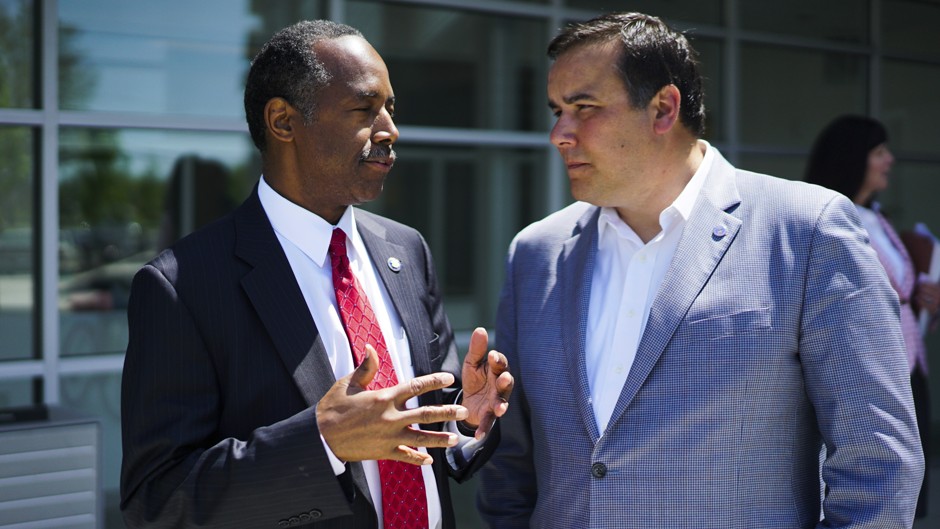 HUD Secretary Ben Carson speaks with Columbus Mayor Andrew Ginther.