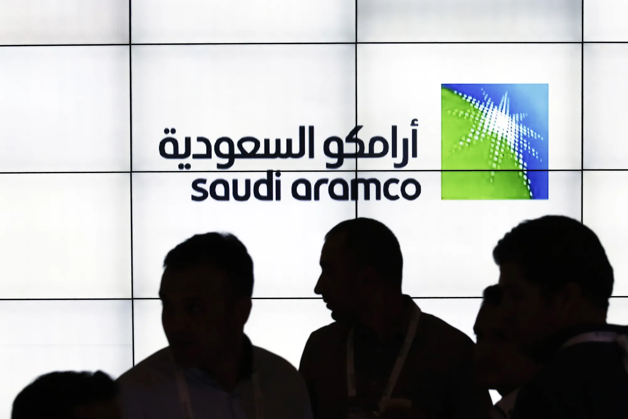 A Saudi Arabian Oil Co. (Aramco) logo sits on an electronic display at the company's corporate pavilion during the 22nd World Petroleum Congress in Istanbul, Turkey, on Wednesday, July 12, 2017. Oil fell from the lowest closing price in two weeks as talk of Libya and Nigeria being requested to cap their production failed to dispel doubts about the effectiveness of OPEC’s cut.