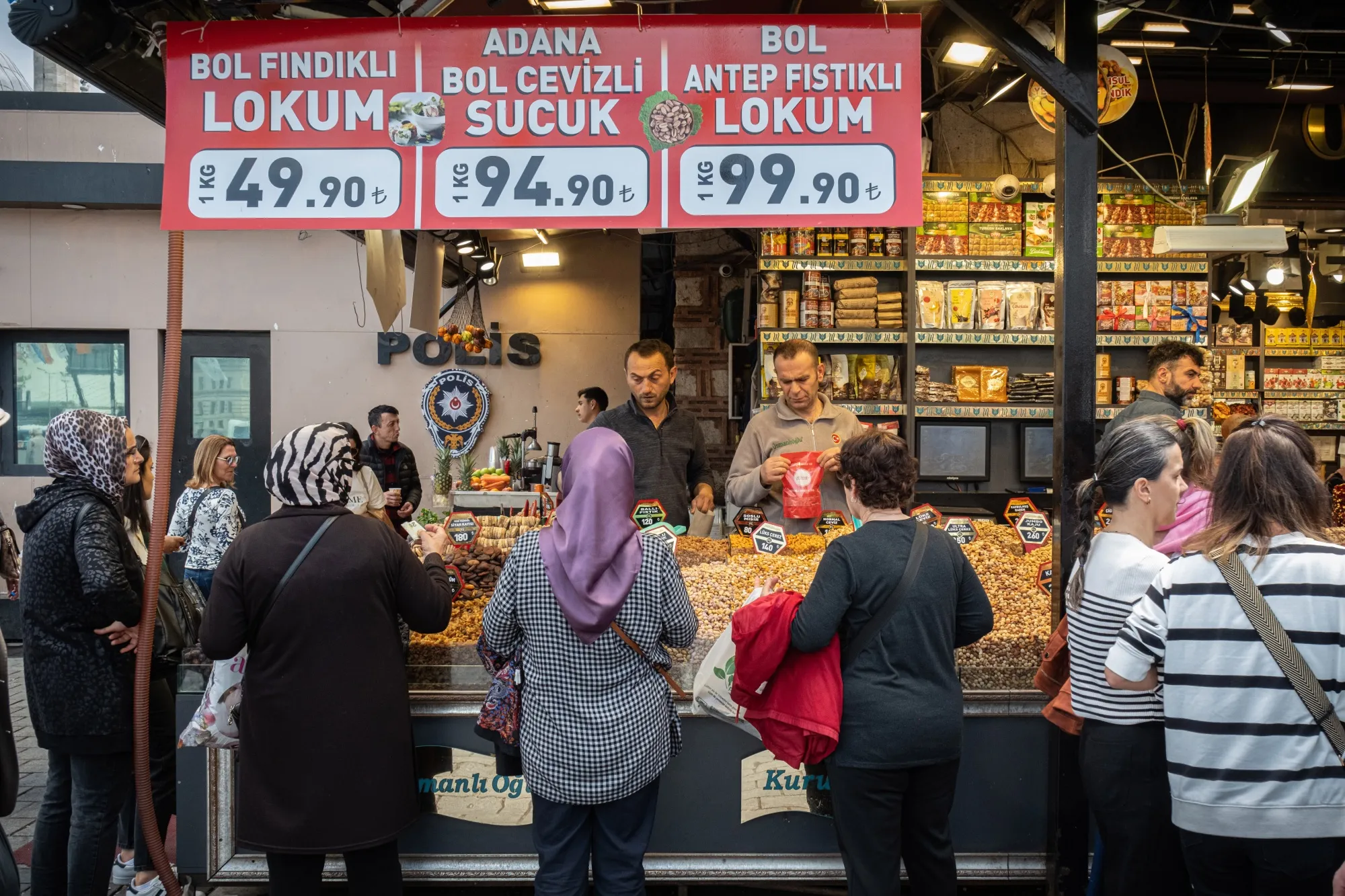 Customers at a grocery stall in Istanbul.