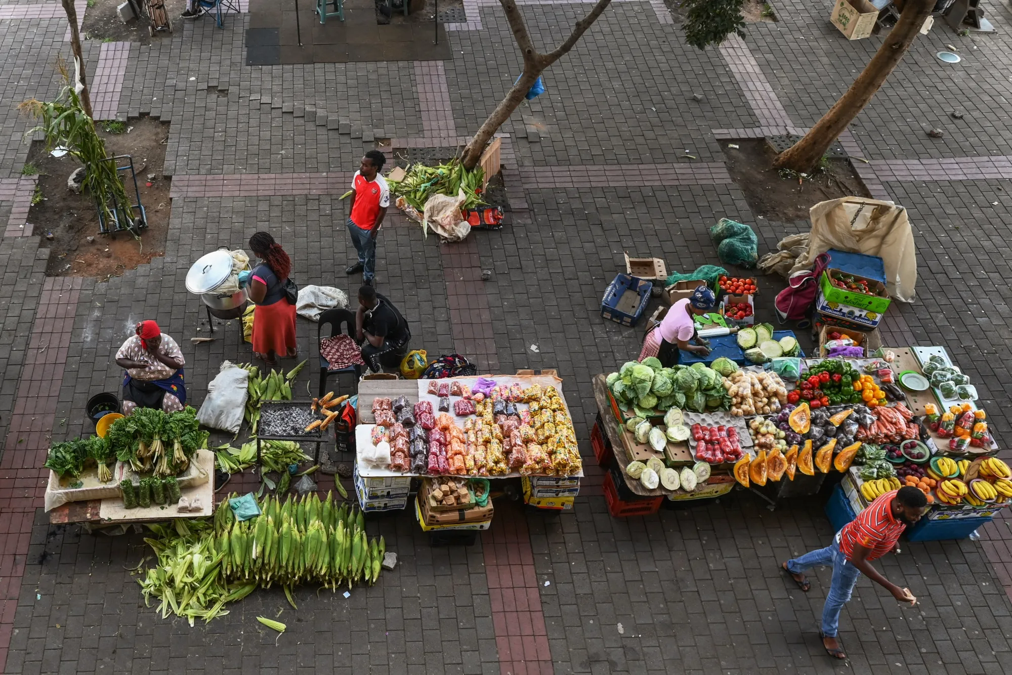 Informal street market stalls display fresh produce for sale in Johannesburg, South Africa.
