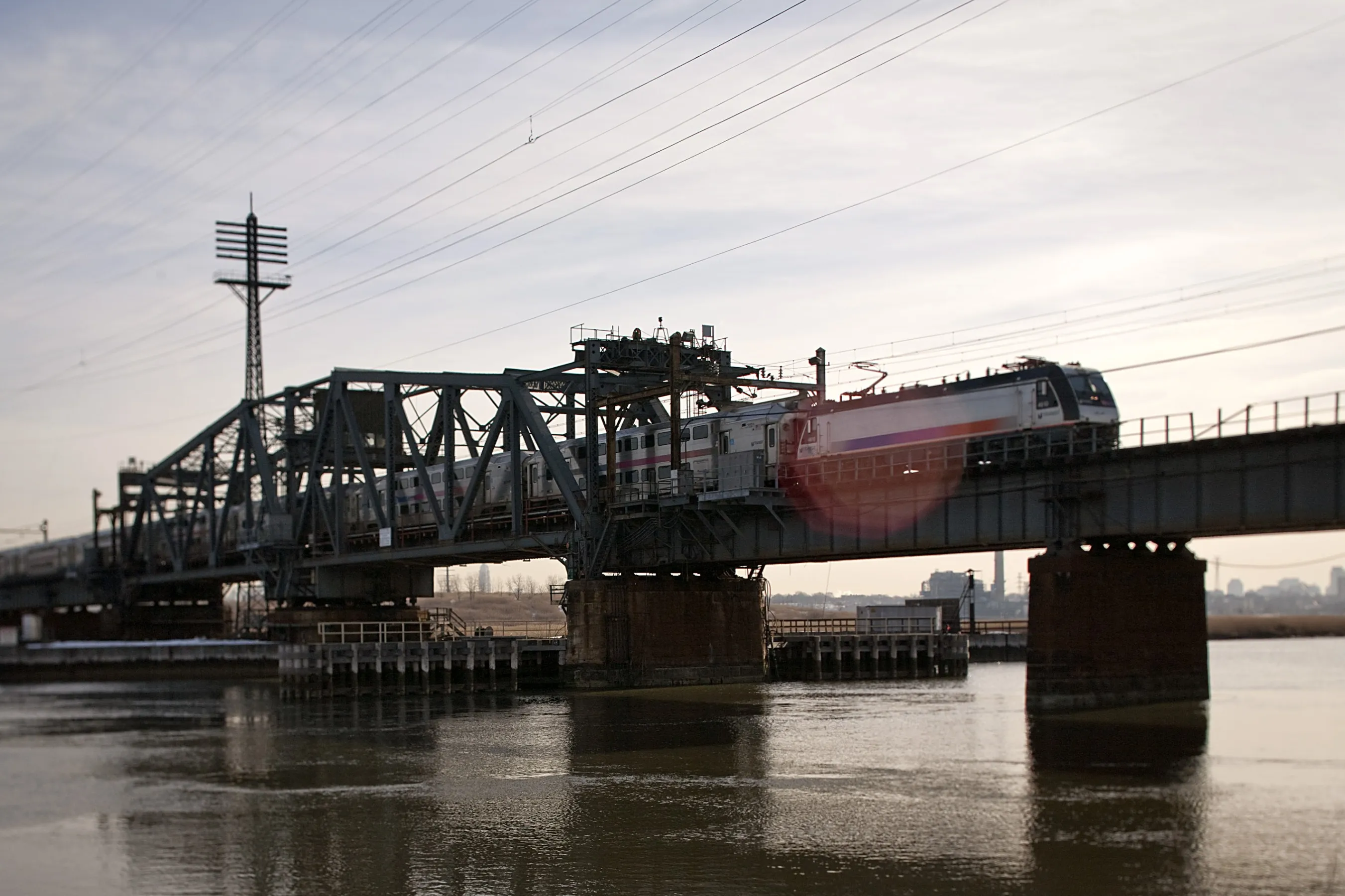A New Jersey Transit train travels on the Portal Bridge between Kearny and Secaucus, New Jersey.