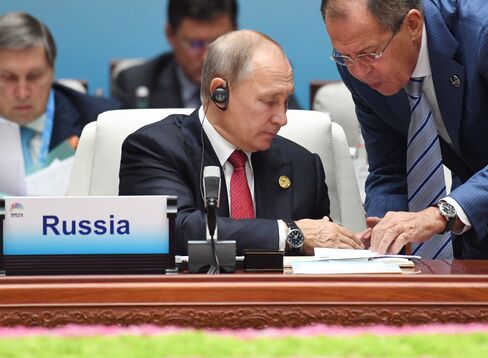 XIAMEN, CHINA - SEPTEMBER 5, 2017: Russia's President Vladimir Putin listens to Russia's Foreign Minister Sergei Lavrov (L-R) at a meeting of the leaders of the BRICS member states and states invited to the 2017 BRICS Summit in the city of Xiamen. Grigory Sysoyev/Russian Presidential Press and Information Office/TASS (Photo by Grigory Sysoyev\TASS via Getty Images)