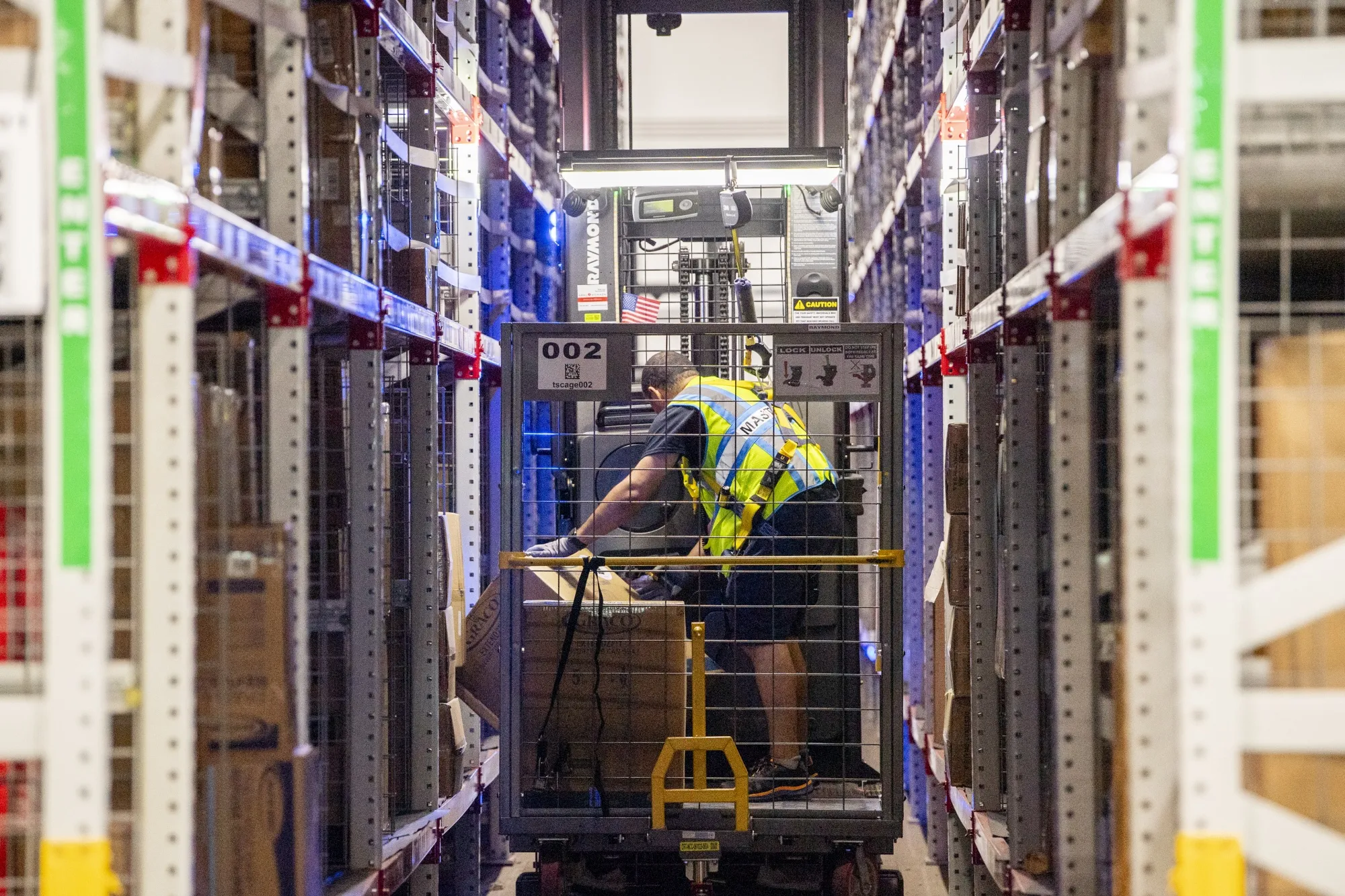 Workers fulfill orders at an Amazon fulfillment center in Melville, New York.