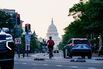 The US Capitol past commuters on Pennsylvania Avenue. 