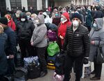 Russian citizens queue for medical control at Kiev railway station on March 27.