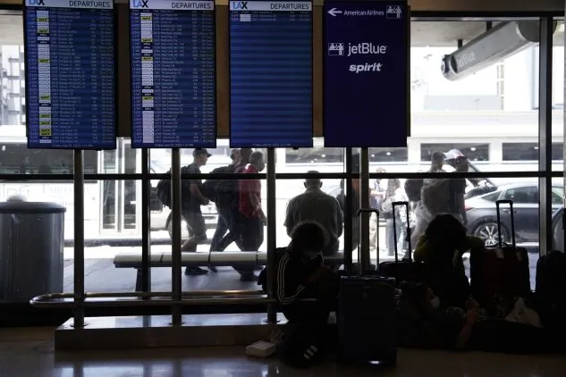 A departures board at Los Angeles International Airport on July 1, 2022. 