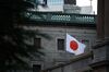 A Japanese flag flies at half-mast, to mark the annivesary of the magnitude-9.0 earthquake and tsunami that left about 20,000 people dead or missing in 2011, outside the Bank of Japan (BOJ) headquarters in Tokyo, Japan, on Monday, March 11, 2019. An increasing number of economists see additional stimulus as the BOJ’s next policy step, while they are unanimous in forecasting no change at this week’s board meeting.