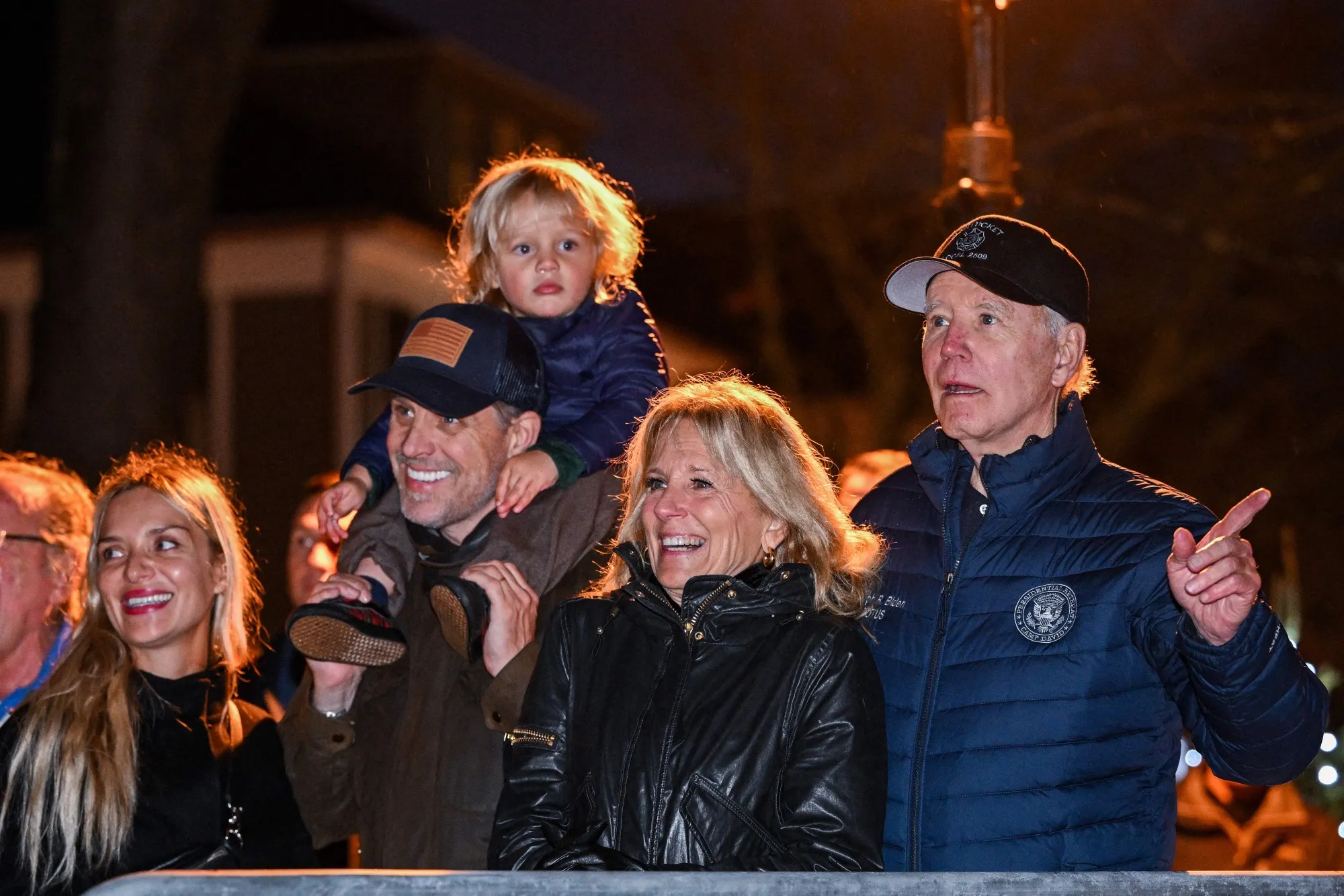 President Joe Biden watches a Christmas tree lighting ceremony with First Lady Jill Biden, son Hunter Biden, grandson Beau, and daughter-in-law Melissa Cohen in Nantucket.
