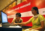 Indian schoolchildren use a laptop to browse a new self assessment and diagnostic Internet site tool in Hyderabad. 