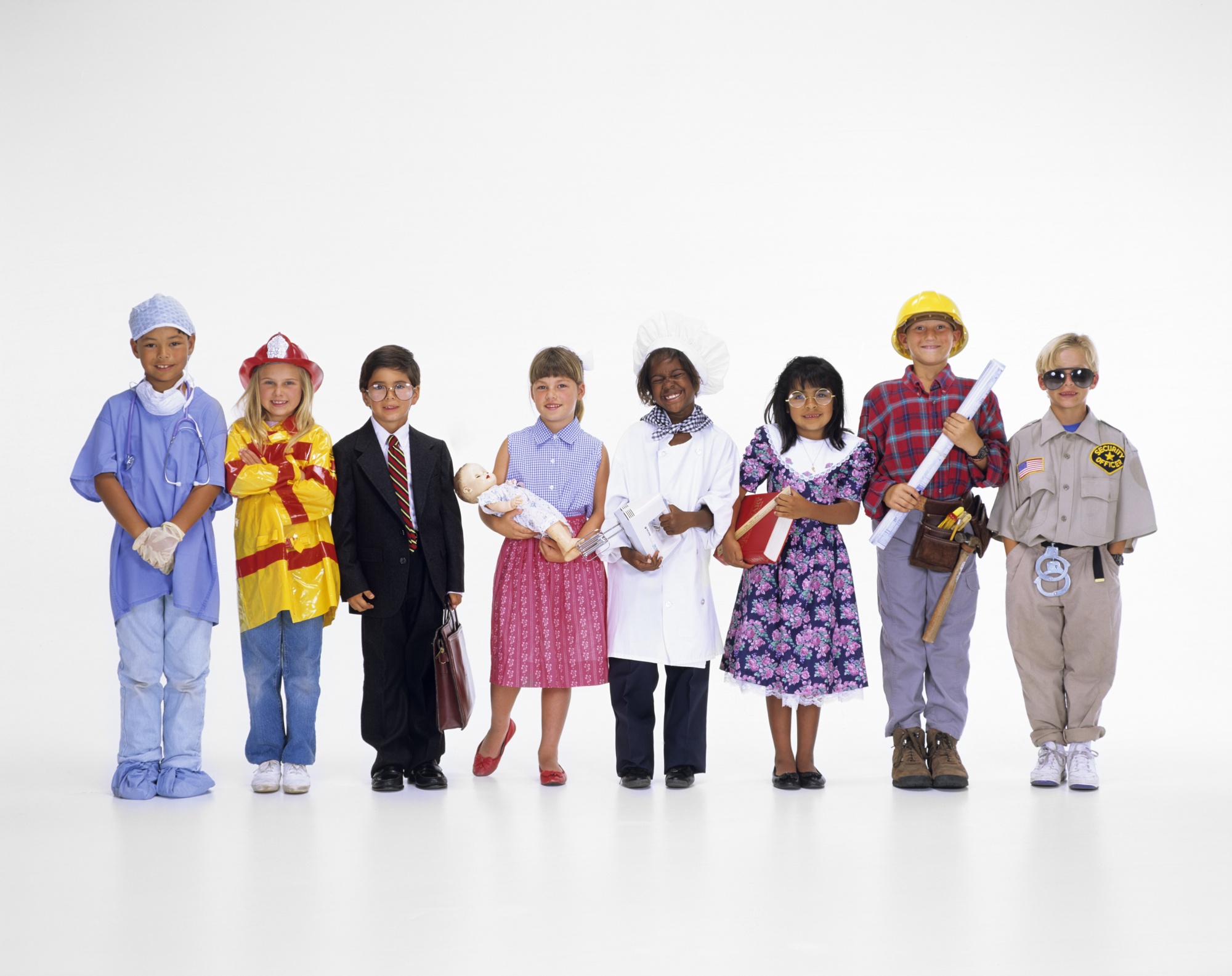 GROUP OF 8 CHILDREN OF VARIOUS ETHNIC GROUPS EACH DRESSED IN COSTUME OF DIFFERENT PROFESSION OR JOB SMILING LOOKING AT CAMERA (Photo by Camerique/Getty Images)