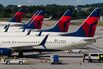 Travelers At Hartsfield–Jackson Atlanta International Airport As Congress Averts FAA Lapse With Stopgap Passage