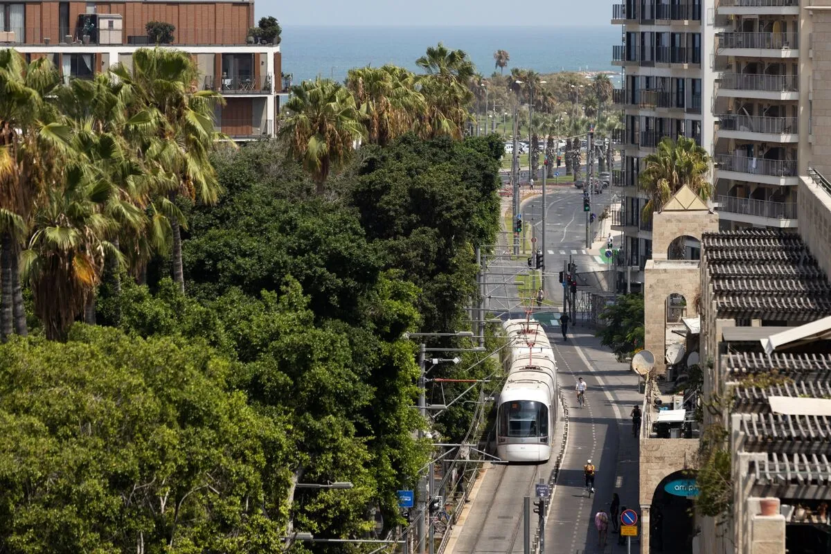 A new metropolitan light rail system train on a test run passes through the Jaffa district of Tel Aviv. The new rail line is expected to cater to&nbsp;70 million passengers a year.