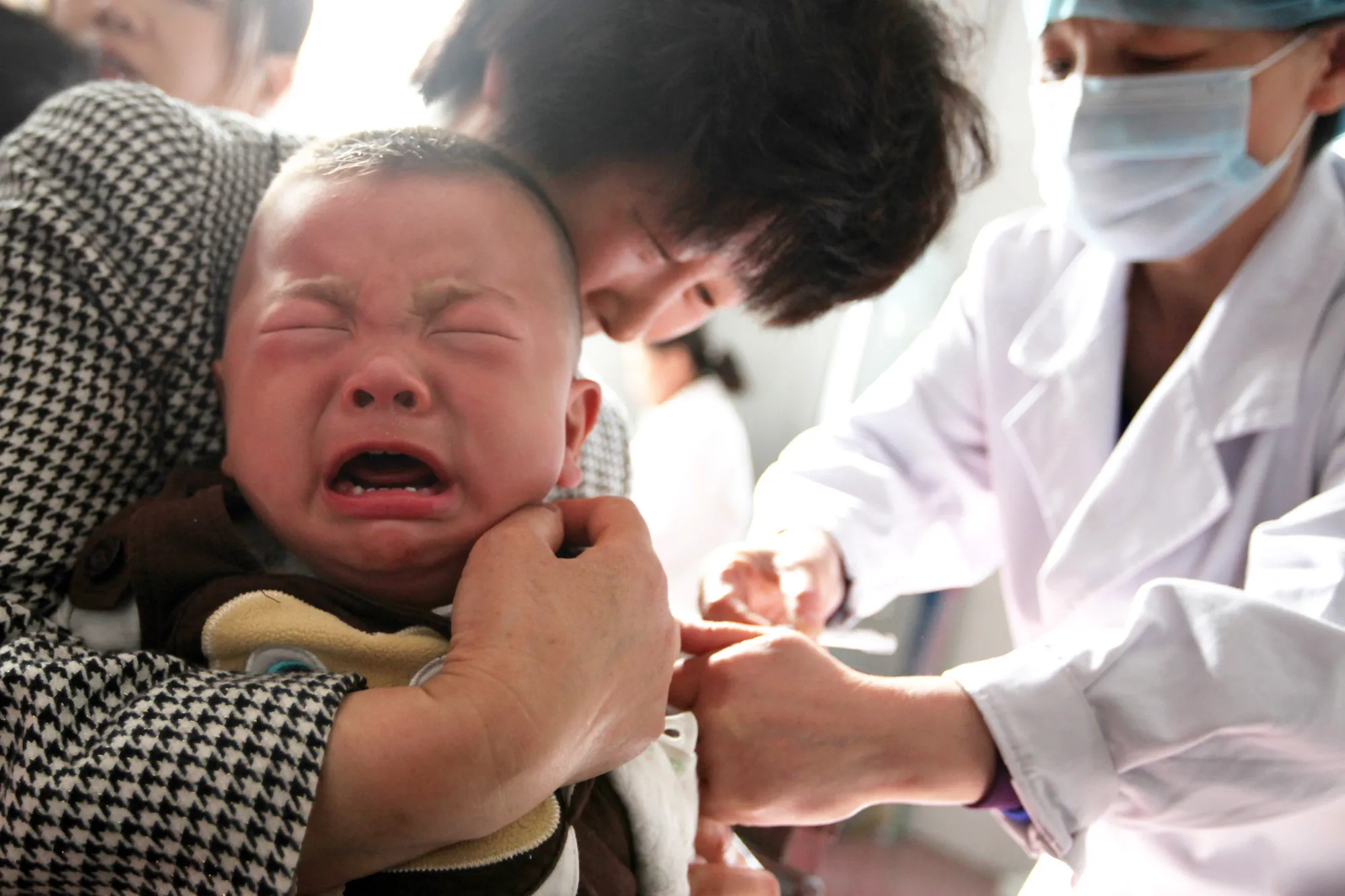 A child receives a vaccination shot at a hospital in Huaibei in China's eastern Anhui province on July 26, 2018.&nbsp;