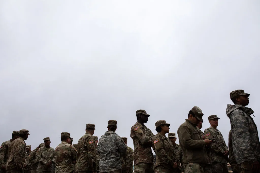 U.S. Army troops deployed to the U.S.-Mexico border line up to receive a&nbsp;meal at a base near the Donna-Rio Bravo International Bridge in Donna, Texas.&nbsp;&nbsp;