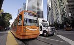 A downtown streetcar is wrapped in an Amazon ad as it waits for passengers in Seattle. 