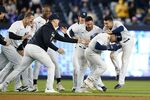 New York Yankees' Jose Trevino, second from right, celebrates with teammates after hitting an RBI single during the 11th inning of the team's baseball game against the Baltimore Orioles on Tuesday, May 24, 2022, in New York. (AP Photo/Frank Franklin II)