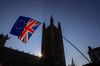 Anti-Brexit campaigners wave a European Union flag and a Union Jack, also known as a Union Flag, during a protest near the Houses of Parliament in London, U.K., on Wednesday, Feb. 27, 2019.