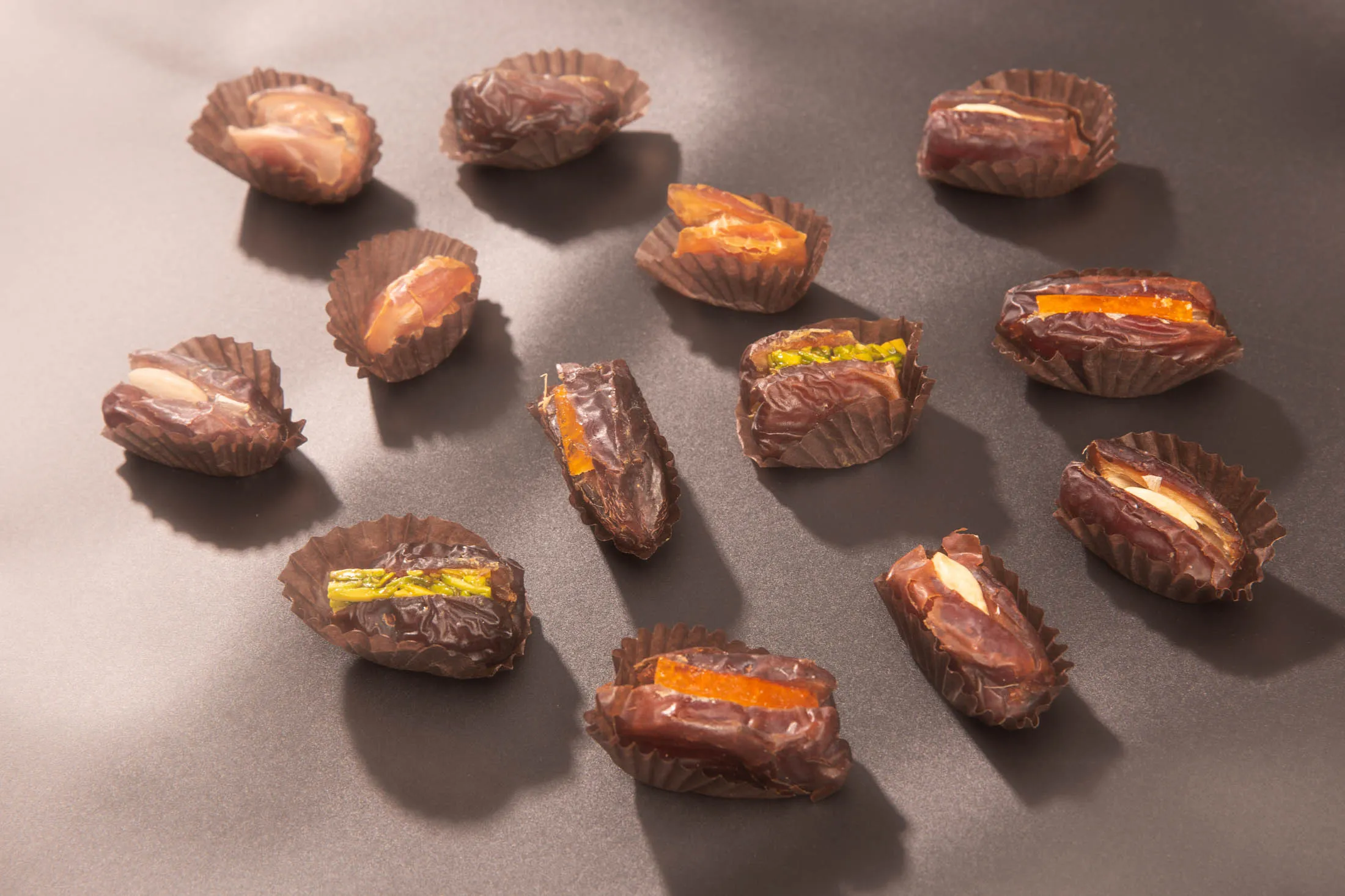 An assortment of Khidri, Kohla, and Wanan dates from Bateel includes fillings such as&nbsp;candied orange peel, pistachios, roasted almonds, and caramelized macadamia nuts.&nbsp;