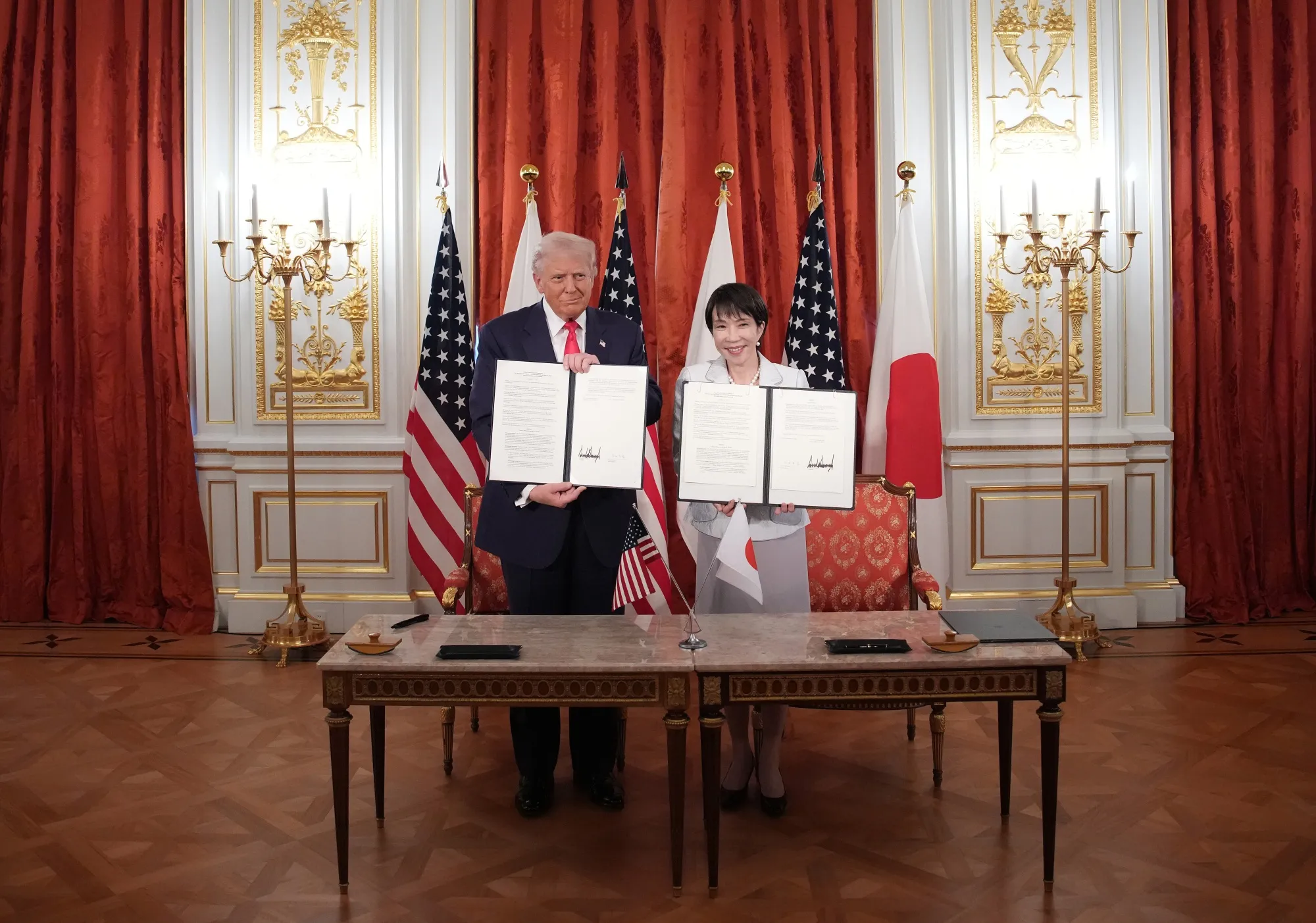 Donald Trump, left, and&nbsp;Sanae Takaichi&nbsp;hold up the signed agreement at a&nbsp;meeting at the Akasaka Palace, in Tokyo, Japan&nbsp;on Oct.&nbsp;28.