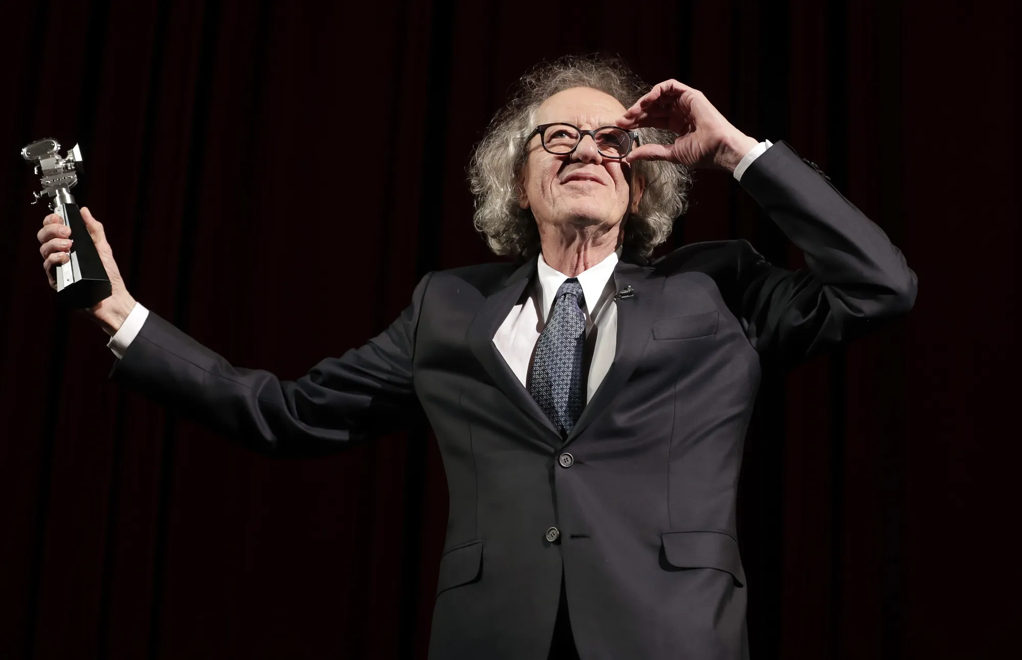 Australian actor Geoffrey Rush poses with his 'Berlinale Camera Award' wich he received prior to the screening of the film 'Final Portrait ' at the 2017 Berlinale Film Festival in Berlin, Germany, Saturday, Feb. 11, 2017. The international film festival in the Czech spa of Karlovy Vary kicks off Friday, July 1, 2022 following a protest by Ukraine against screening a Russian movie. This year’s festival will honor Oscar-winning actor Geoffrey Rush for his outstanding contribution to world cinema at the festival’s closing ceremony. (AP Photo/Michael Sohn, File)