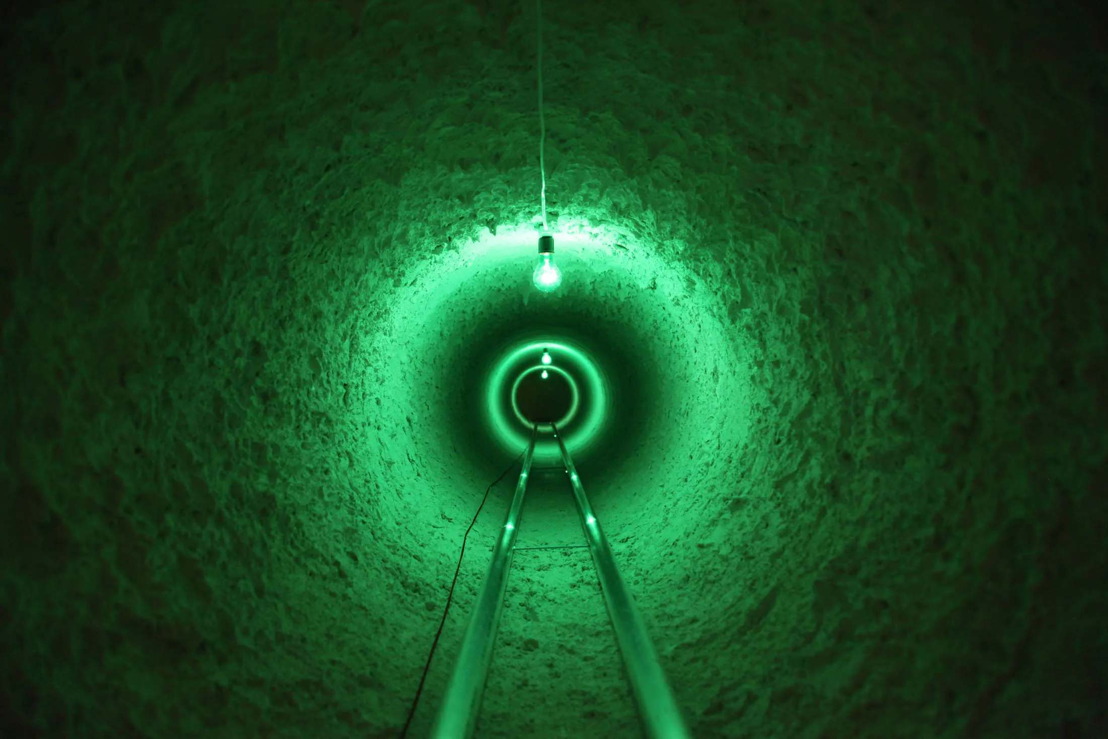 A fictional tunnel linking China, the U.S., and Mexico, from Mika Rottenberg’s video Cosmic Generator (2017).